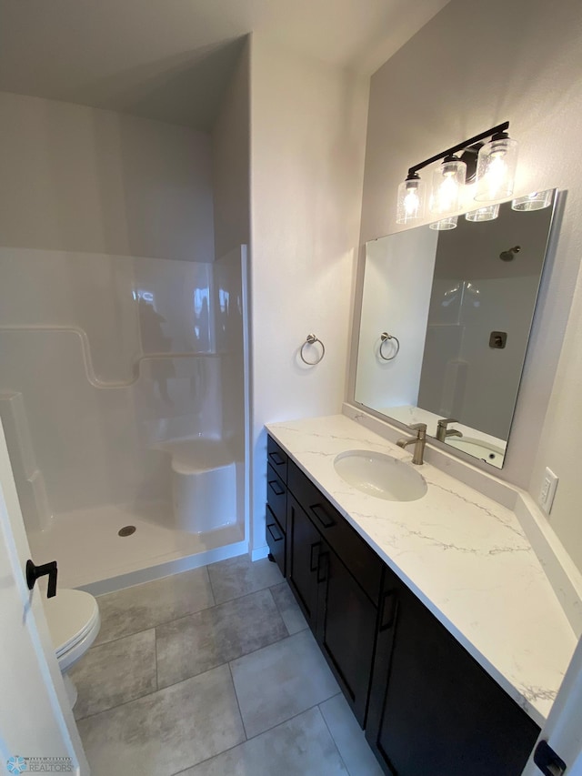 1312 Southview Dr SW, Glyndon, MN 56547 - bathroom featuring a walk in shower, toilet, vanity, and tile patterned floors