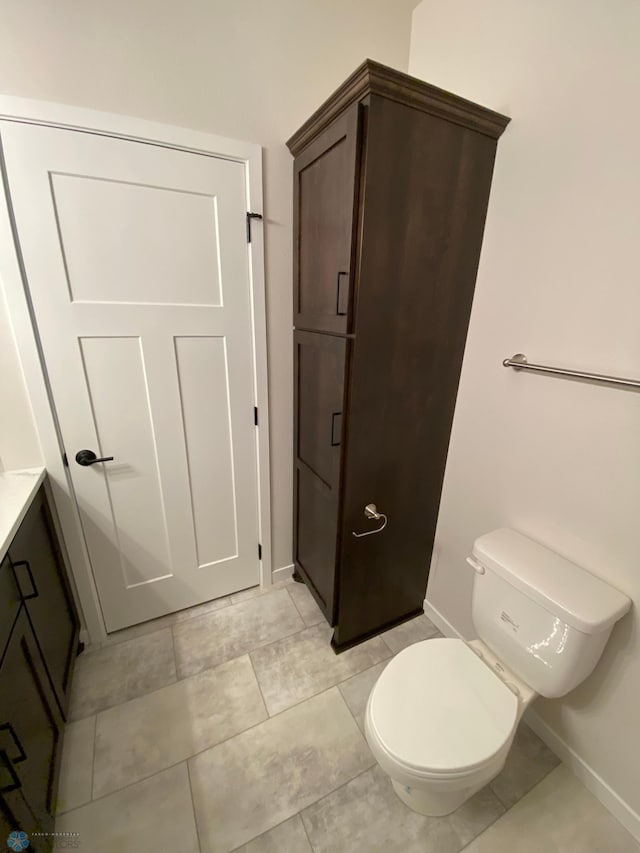 1312 Southview Dr SW, Glyndon, MN 56547 - bathroom with baseboards, toilet, and vanity