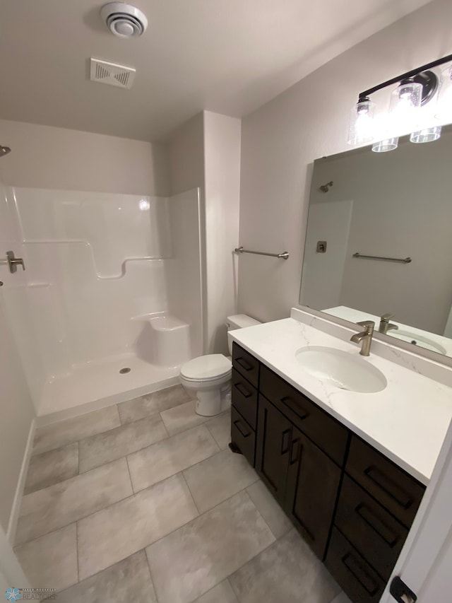 1312 Southview Dr SW, Glyndon, MN 56547 - bathroom featuring a shower, toilet, vanity, and tile patterned floors