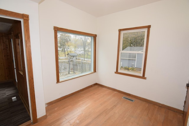 unfurnished room with light hardwood / wood-style flooring