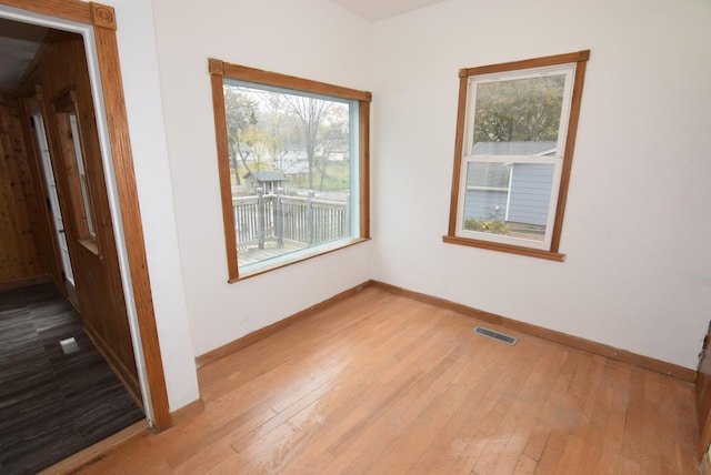 unfurnished room featuring light hardwood / wood-style floors