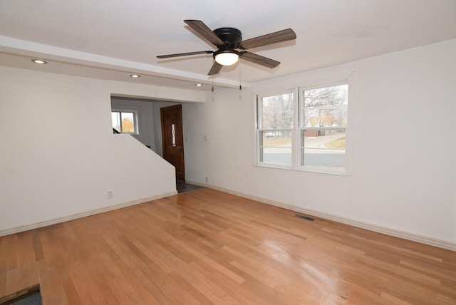 spare room with ceiling fan and light hardwood / wood-style flooring