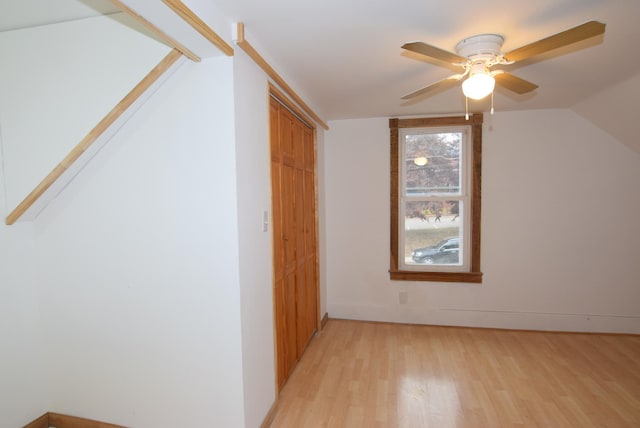 bonus room with light hardwood / wood-style floors, ceiling fan, and vaulted ceiling