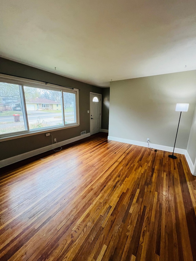 unfurnished living room with light hardwood / wood-style floors