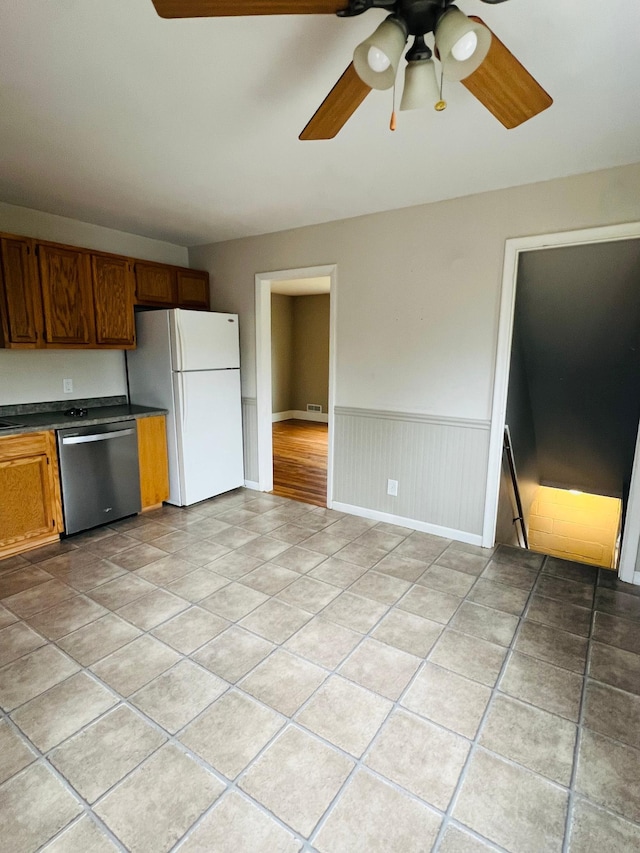 kitchen with dishwasher, ceiling fan, and white fridge