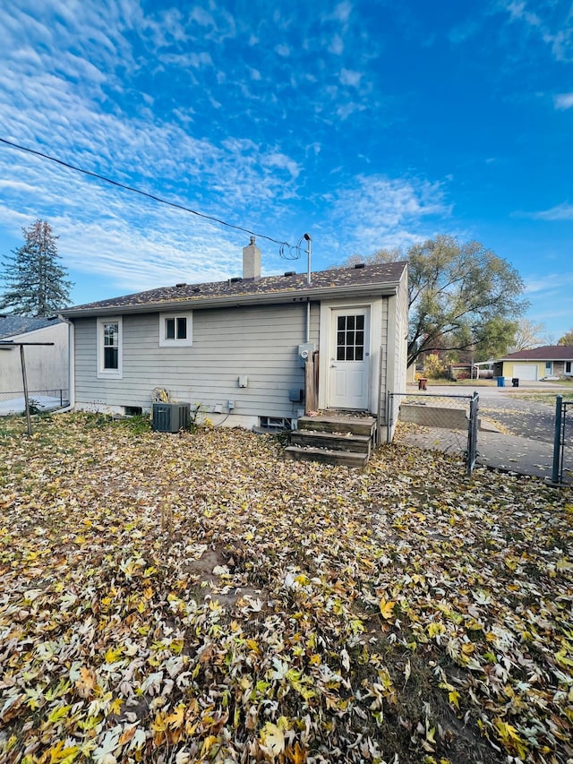 back of property featuring central air condition unit