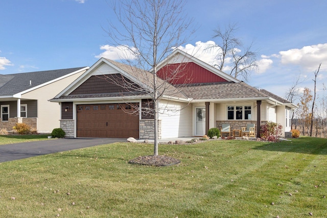 view of front of home featuring a front yard and a garage