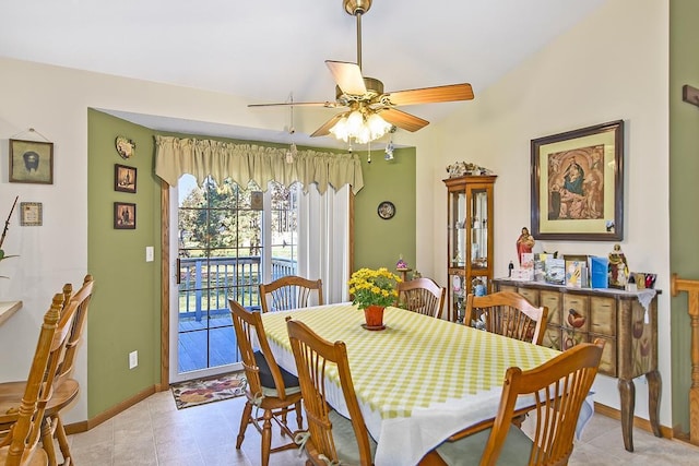 dining room with ceiling fan and light tile patterned floors