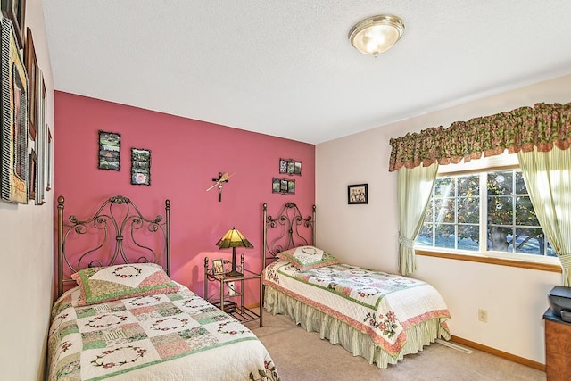 carpeted bedroom with a textured ceiling