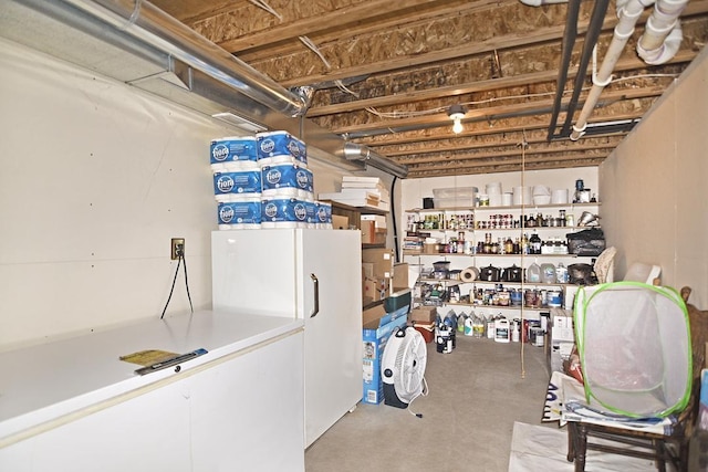 basement featuring white refrigerator