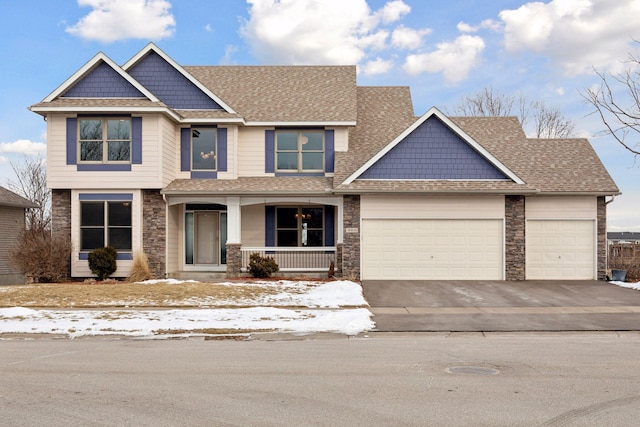 craftsman-style home featuring a garage and covered porch