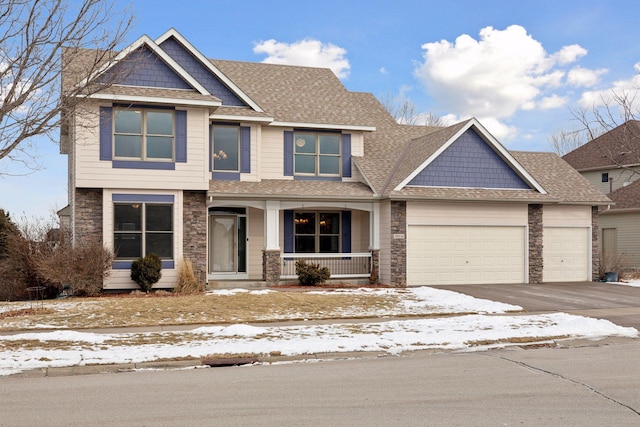 craftsman-style home with a porch and a garage