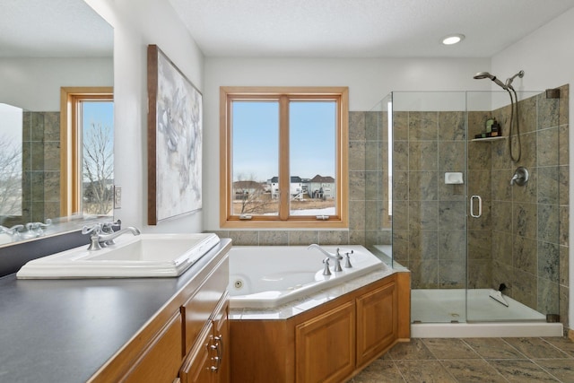 bathroom featuring vanity and plus walk in shower