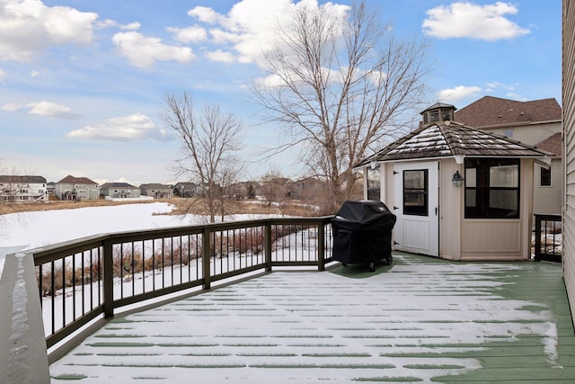 snow covered deck featuring grilling area