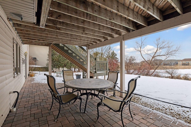 view of snow covered patio