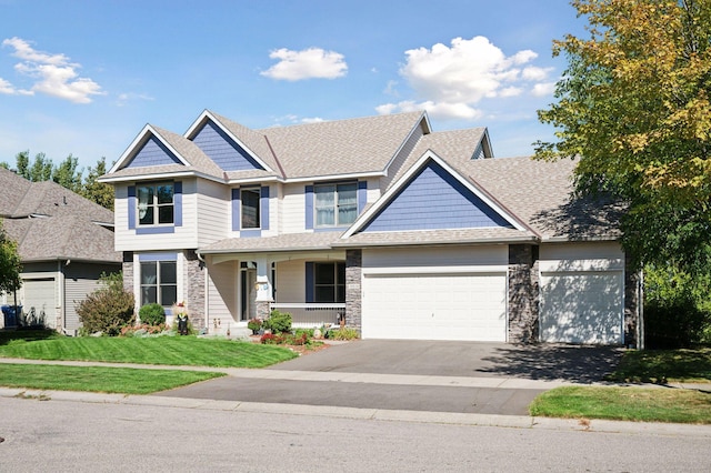 view of front of home with a porch and a front yard