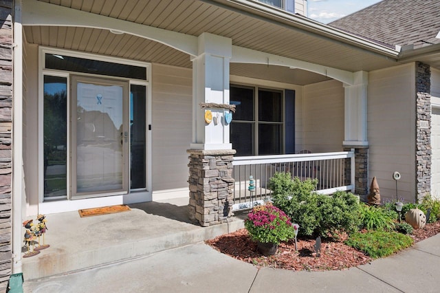 entrance to property featuring a porch