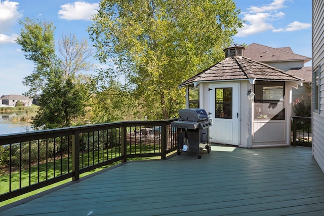 wooden deck with a grill