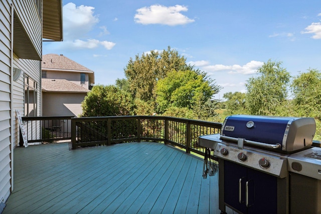 wooden terrace featuring a grill