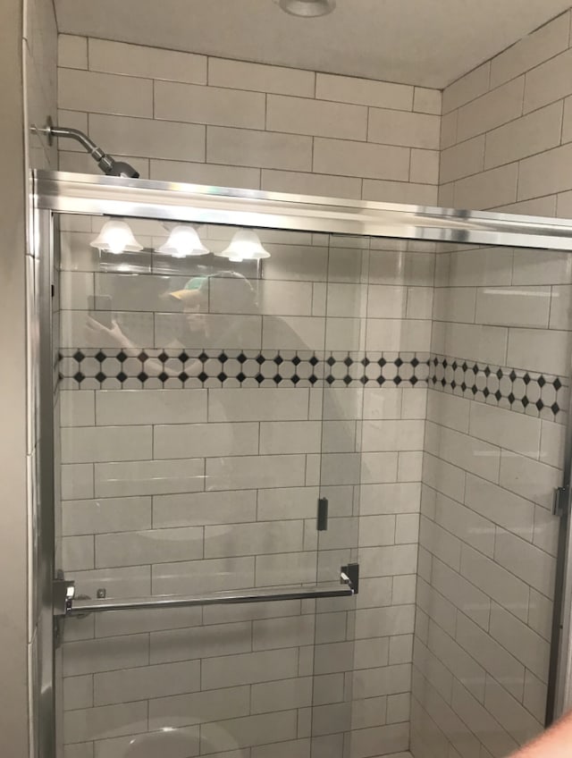 bathroom with an enclosed shower