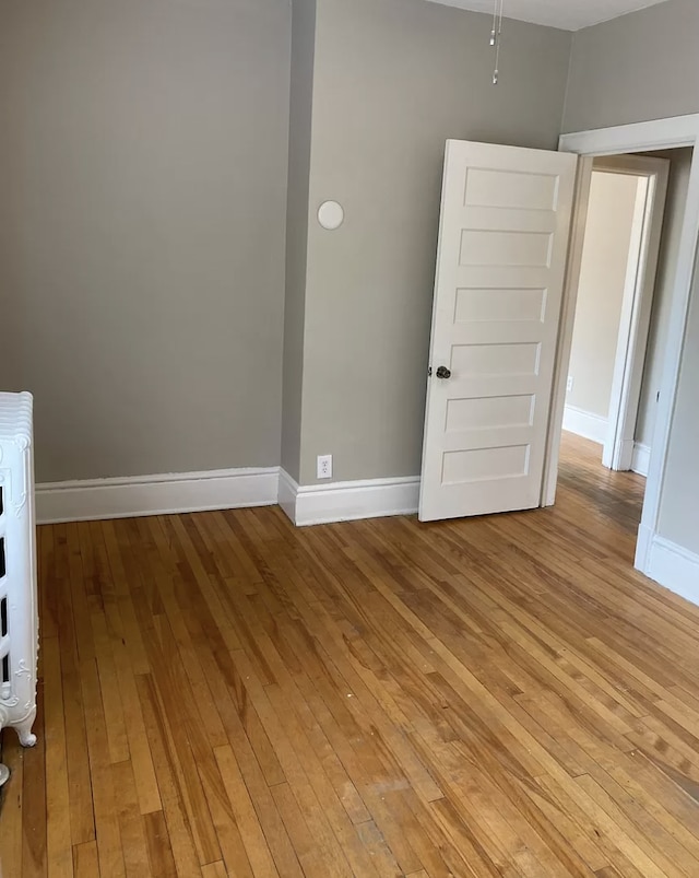 unfurnished room with light hardwood / wood-style flooring