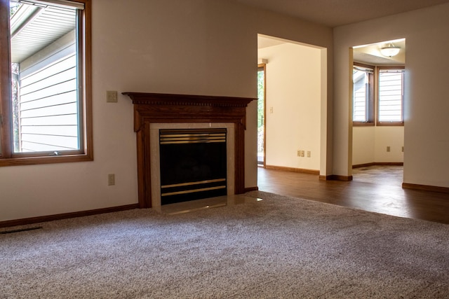 unfurnished living room featuring dark hardwood / wood-style flooring