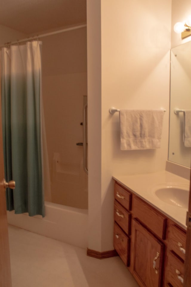 bathroom featuring shower / bath combination with curtain and vanity