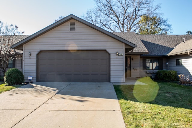 single story home featuring a garage, a front yard, concrete driveway, and a shingled roof