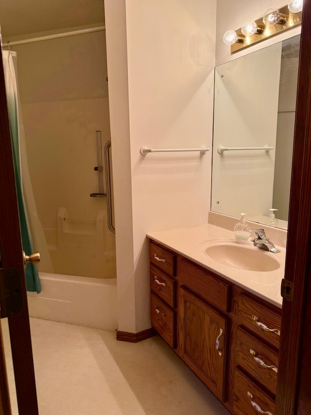 bathroom with shower / bath combo and vanity