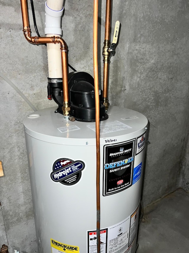 utility room featuring gas water heater