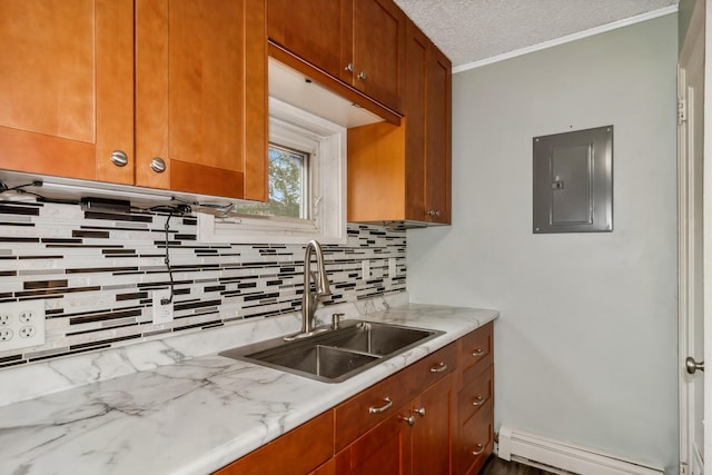 kitchen with tasteful backsplash, sink, a textured ceiling, baseboard heating, and electric panel