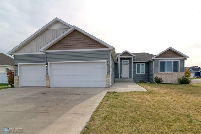 view of front facade with a front yard and a garage