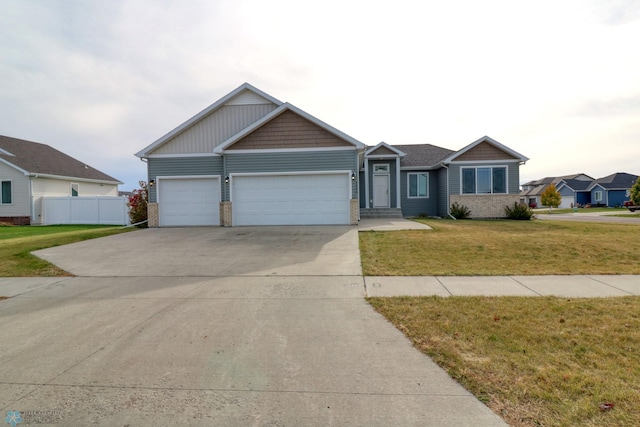 view of front of house with a front lawn and a garage