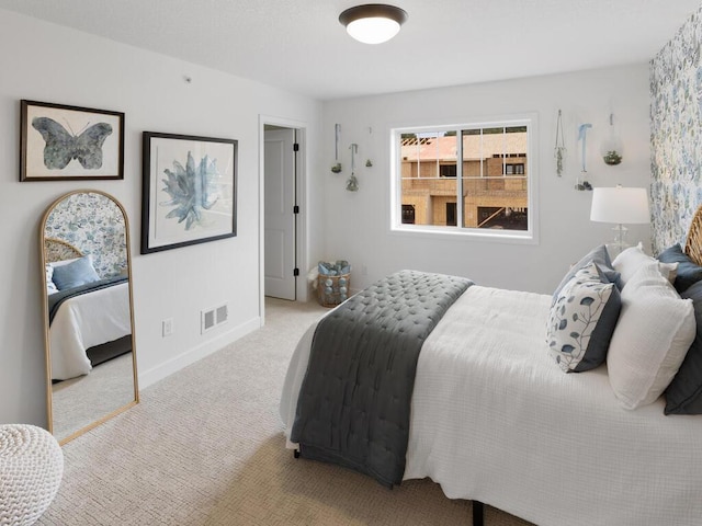 bedroom featuring light carpet