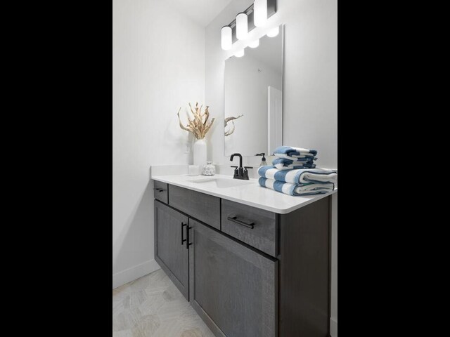 13609 Hollybrook Dr, Apple Valley, MN 55124 - bathroom featuring vanity and baseboards