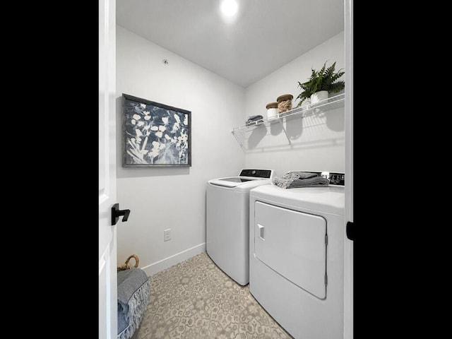 clothes washing area with washer and dryer