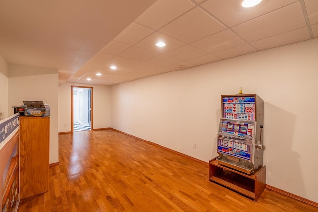 interior space featuring hardwood / wood-style flooring and a paneled ceiling