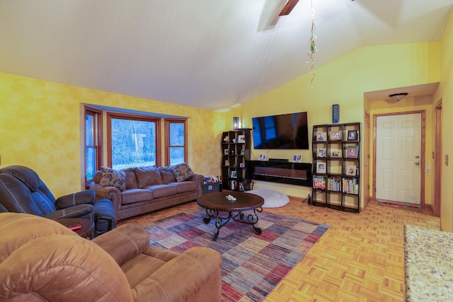 living room featuring ceiling fan, light parquet floors, and lofted ceiling