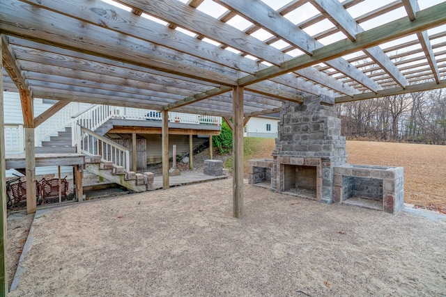 view of patio / terrace featuring central air condition unit, a wooden deck, a pergola, and an outdoor stone fireplace