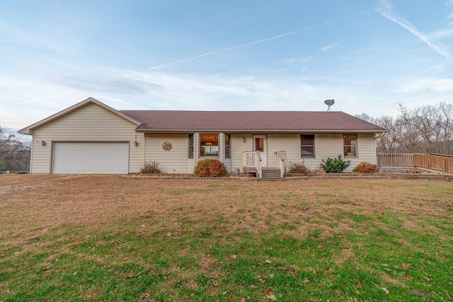 ranch-style home featuring a garage and a front yard