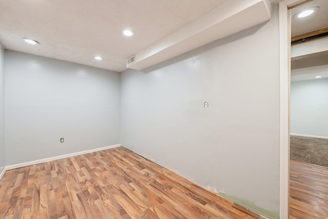 unfurnished room with hardwood / wood-style floors