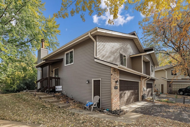 view of side of home featuring a garage