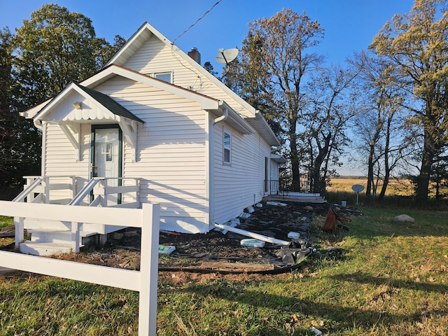 view of home's exterior with a yard