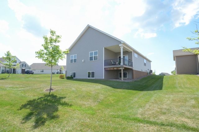19266 Hunters Pl, Rogers, MN 55374 - rear view of property featuring a lawn and a balcony