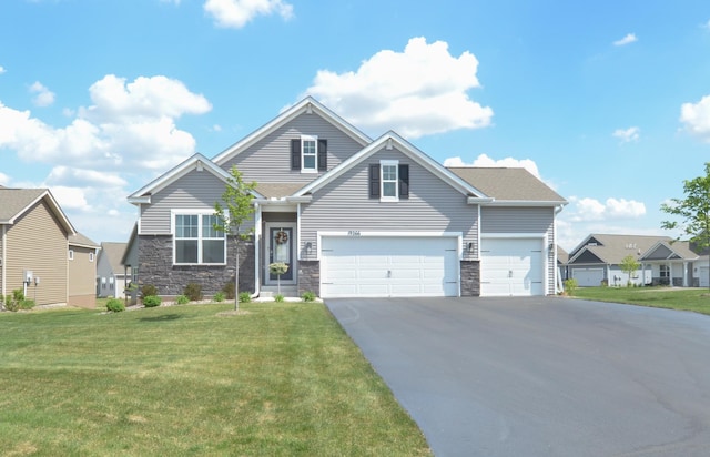 19266 Hunters Pl, Rogers, MN 55374 - view of front of home with asphalt driveway, a front lawn, and stone siding