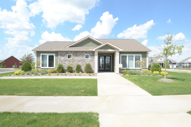 19266 Hunters Pl, Rogers, MN 55374 - craftsman inspired home featuring french doors, stone siding, a front yard, and concrete driveway