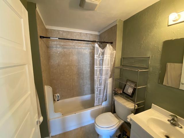 full bathroom with toilet, shower / bath combination with curtain, and vanity