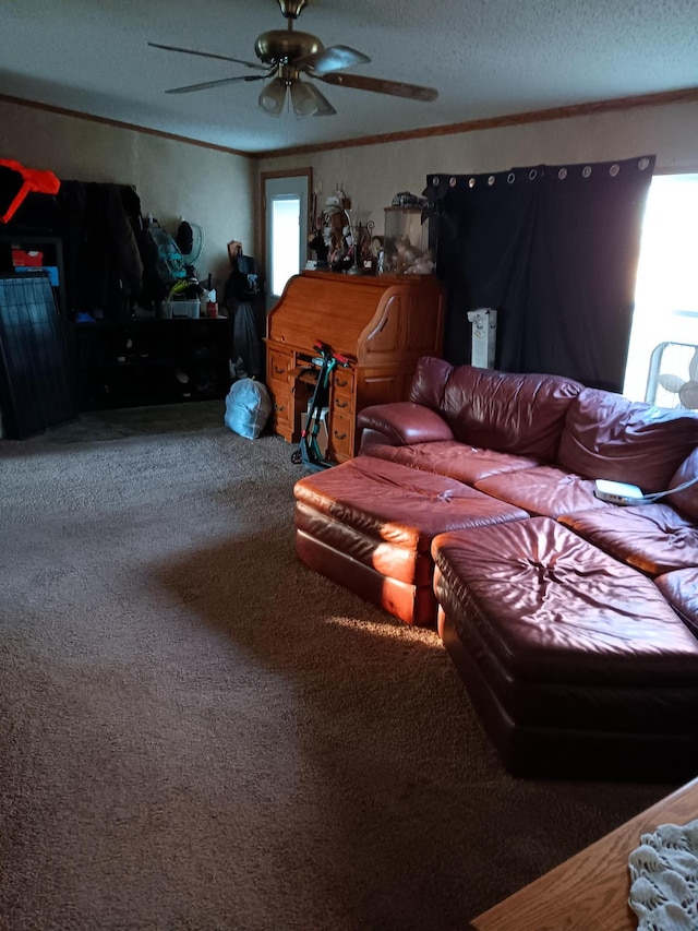 living room with a textured ceiling, carpet floors, and ceiling fan