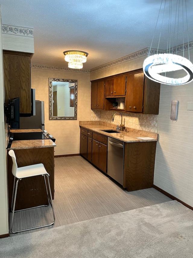 kitchen featuring light carpet, sink, and stainless steel dishwasher