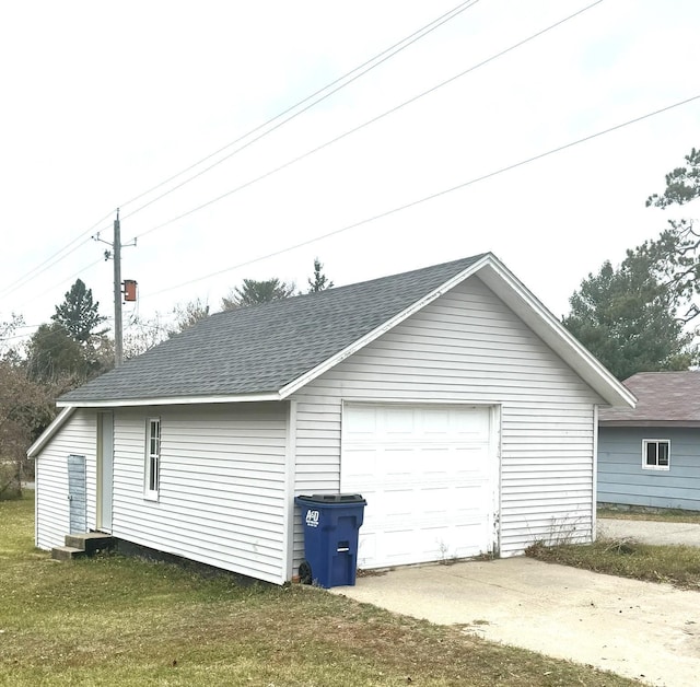 garage with a yard